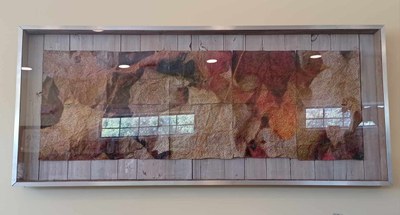Community Art Project with panels of colored autumn leaves in a wooden frame